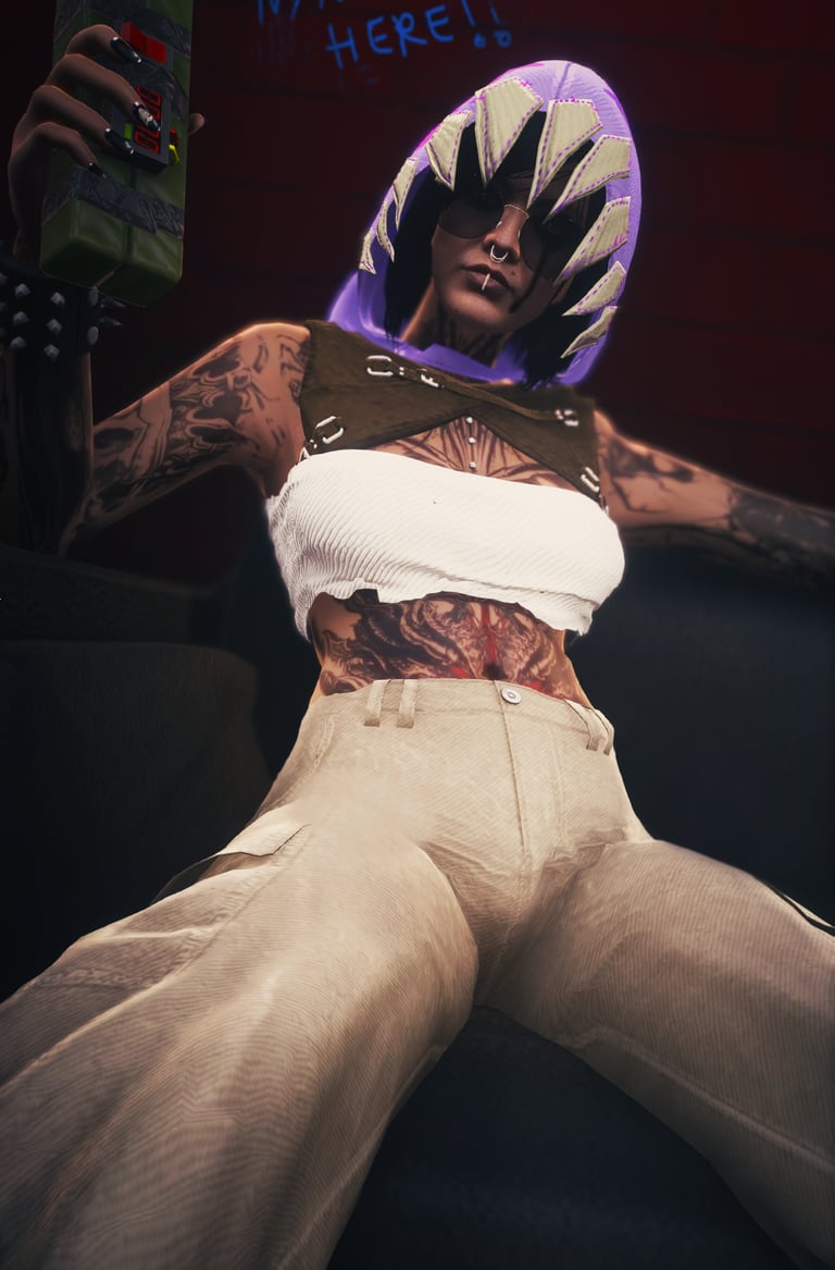 a man with tattoos on his chest and arms