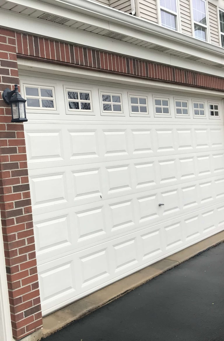 a car parked in front of a garage door