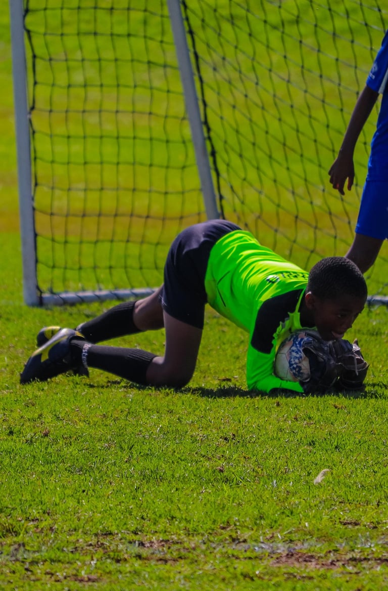 a soccer player is trying to get the ball
