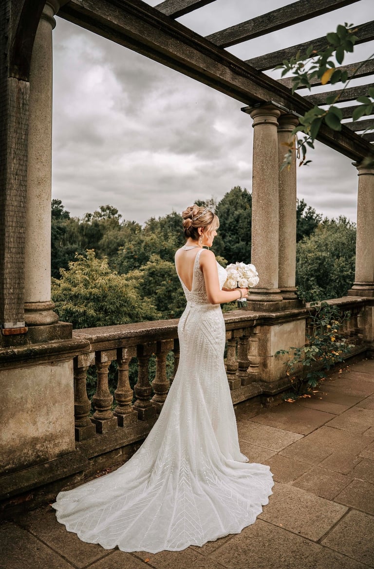Bride in elegant backless wedding dress captured by Fred Art Studio in London garden
