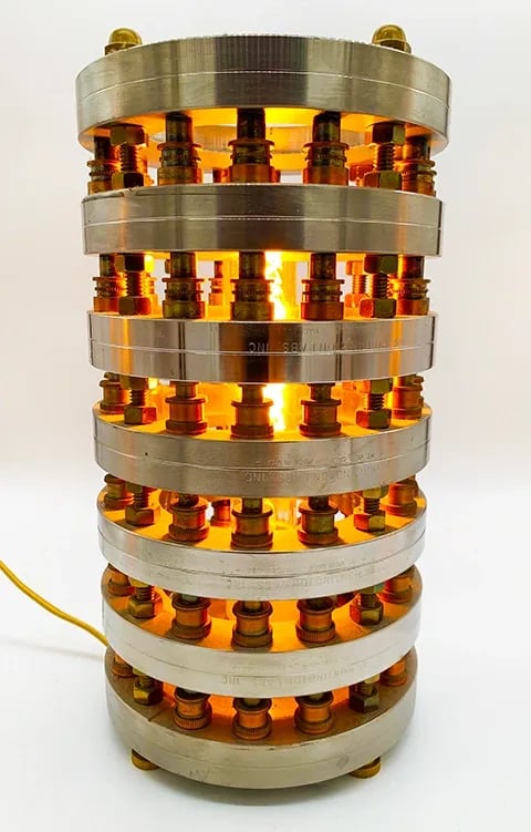 Custom light made from stainless and brass objects.
