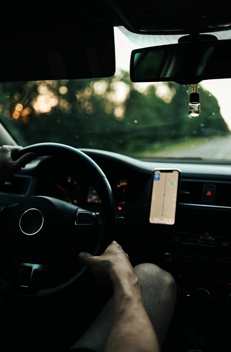a person is driving a car with a gps device