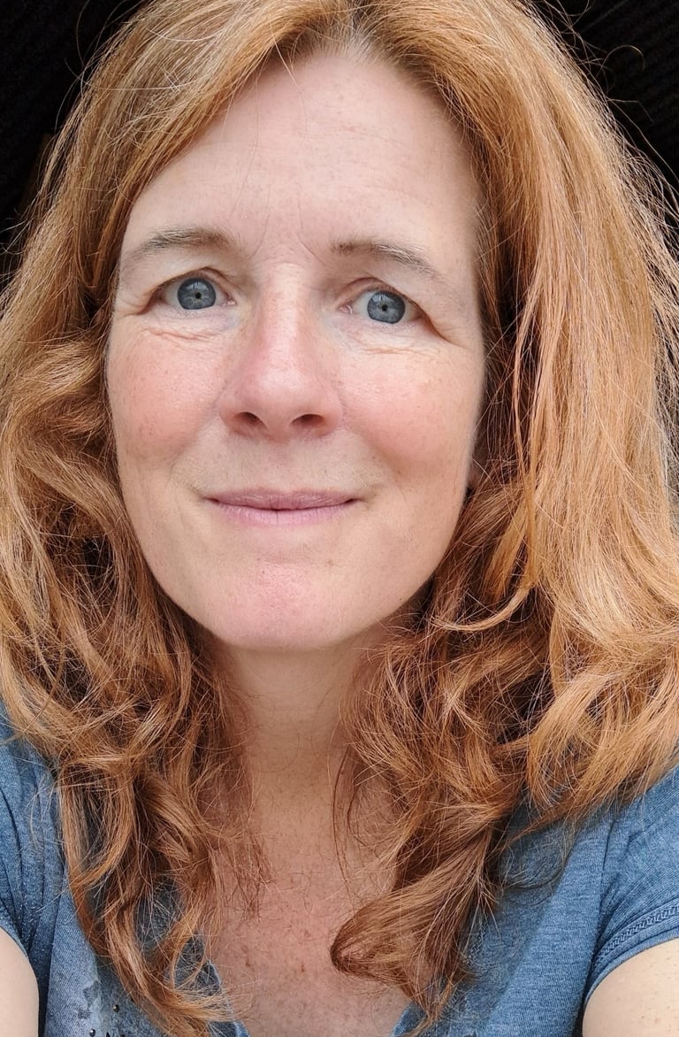 a woman with red hair and blue eyes nathalie van der stelt