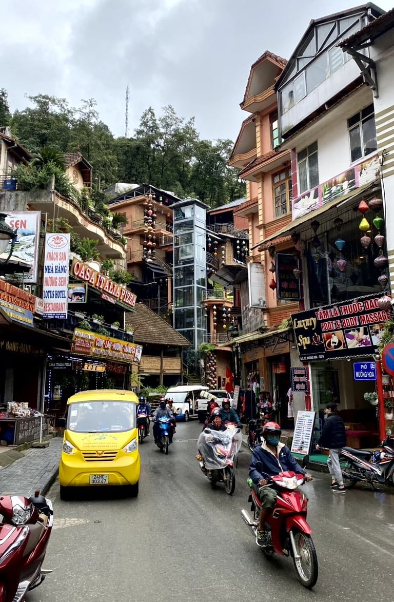 a yellow taxi cab driving down a street