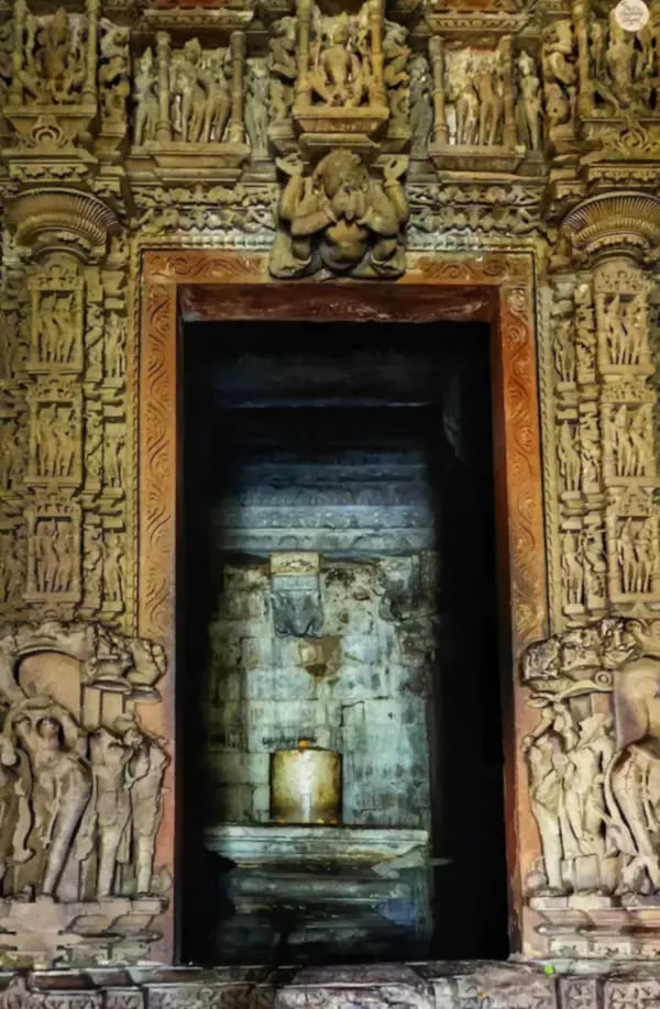 Inner sanctum of Kandariya Mahadev Temple, Khajuraho with detailed stone architecture.