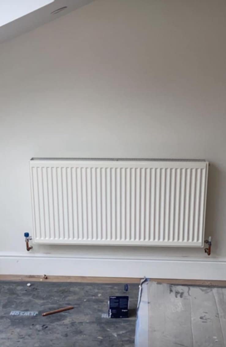wall-mounted towel rail radiator installed by Gas Safe engineer in Evesham
