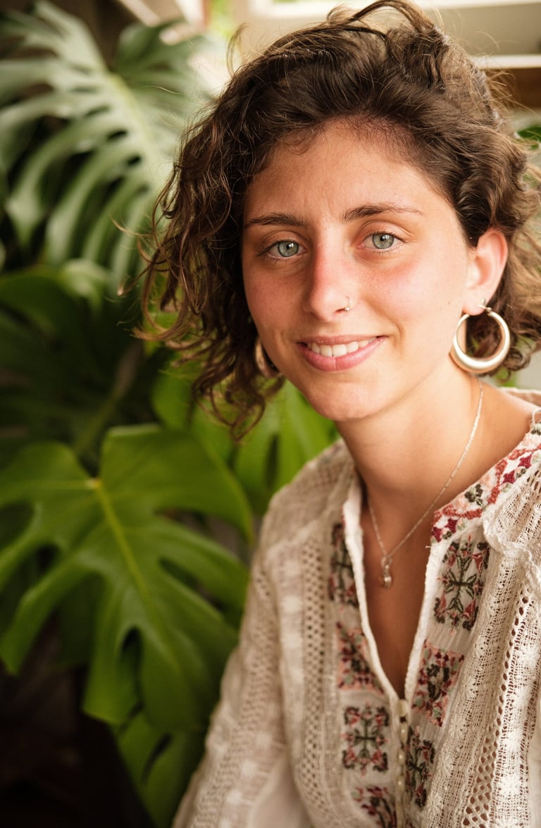 a woman with a large earring 