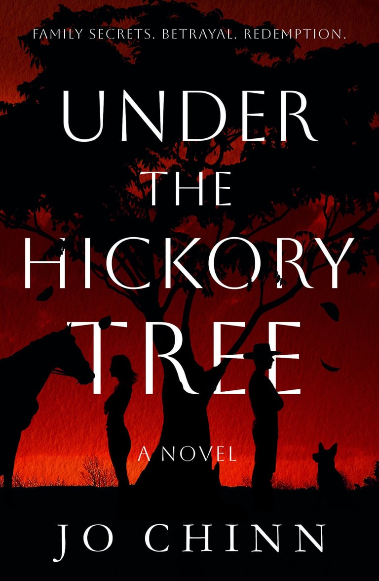 Silhouette of a man and a woman, back to back, under a hickory treee, framed against a blood red sky