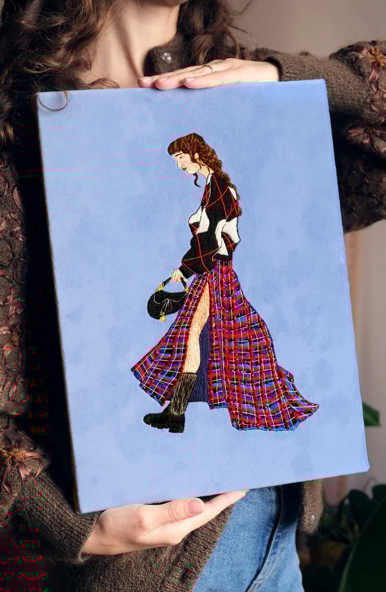 Embroidery artwork of a fashion illustration ; a woman is walking with Dior bag and kilt skirt 
