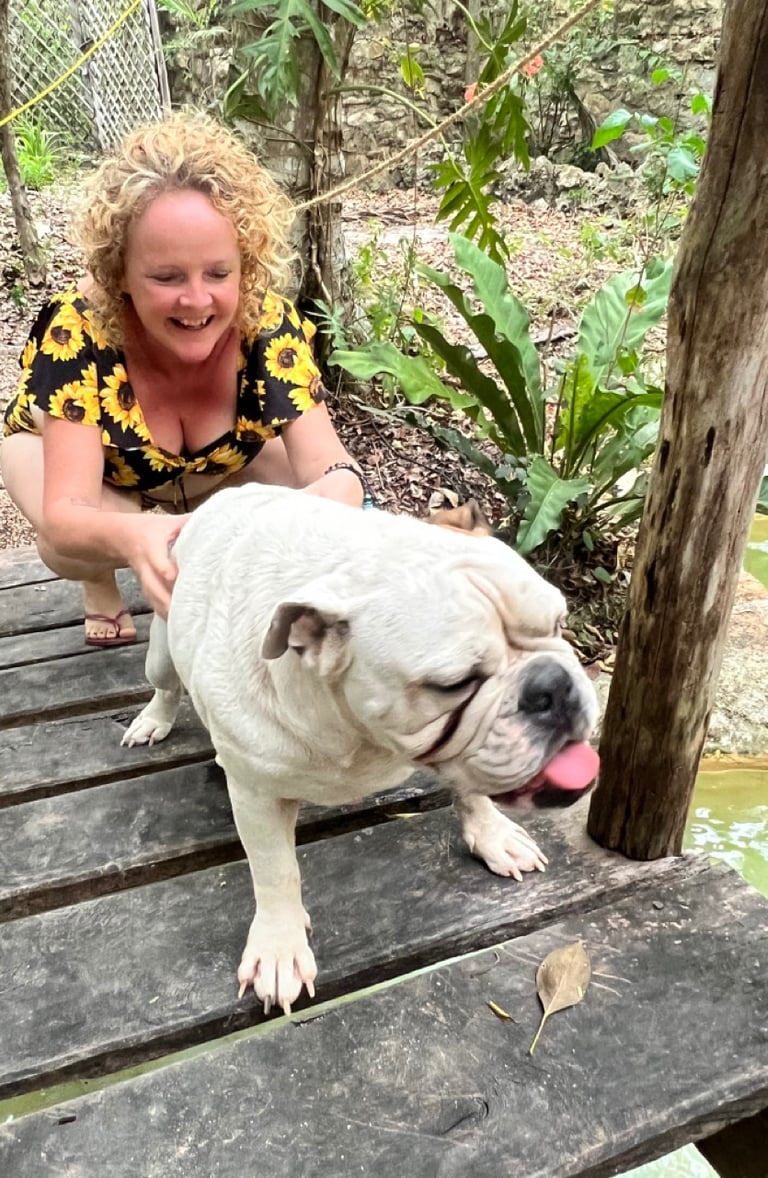 Sunni Dawson massaging dog after animal communication session