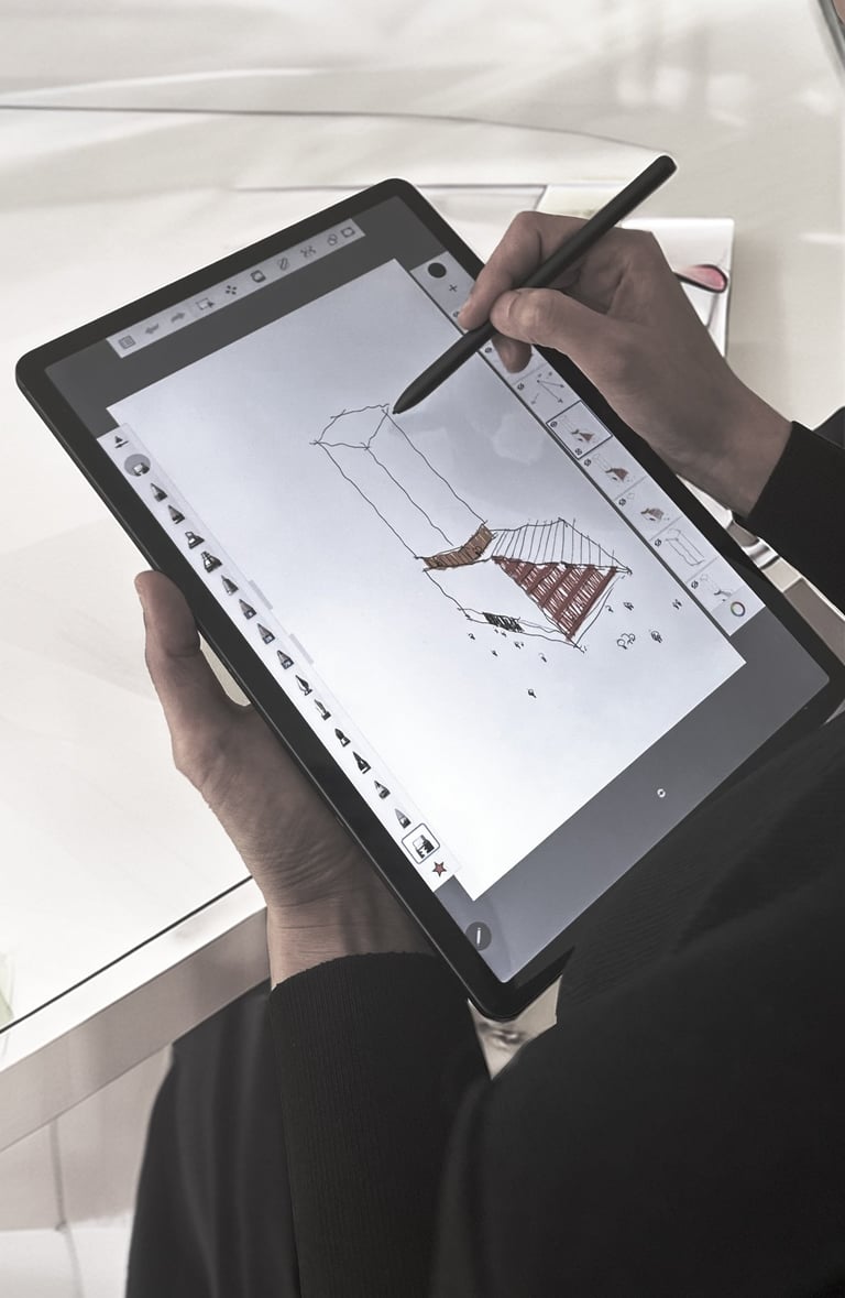 a person holding a pen and drawing on a tablet a conceptual architectural drawings