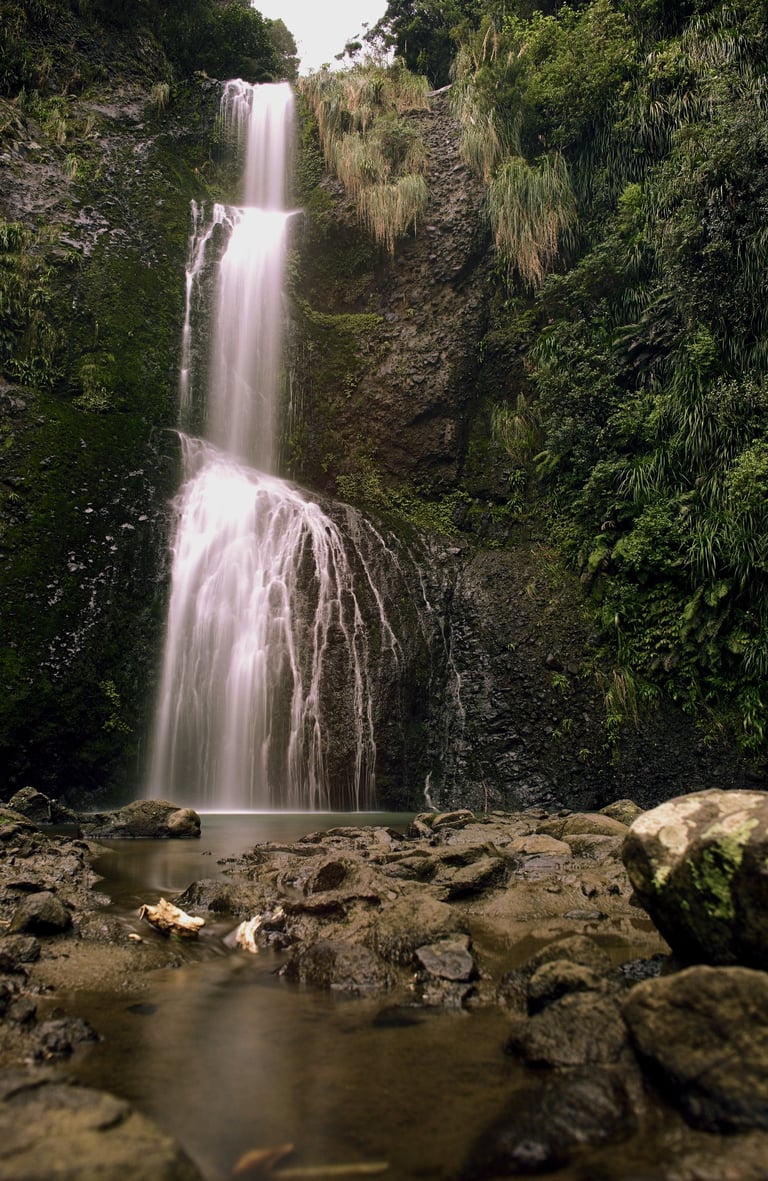A long exposure capturing the cascading Kitekite Falls; Piha, New Zealand - Fine art photograph
