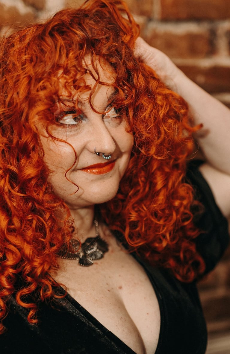 woman with ginger/copper curly hair