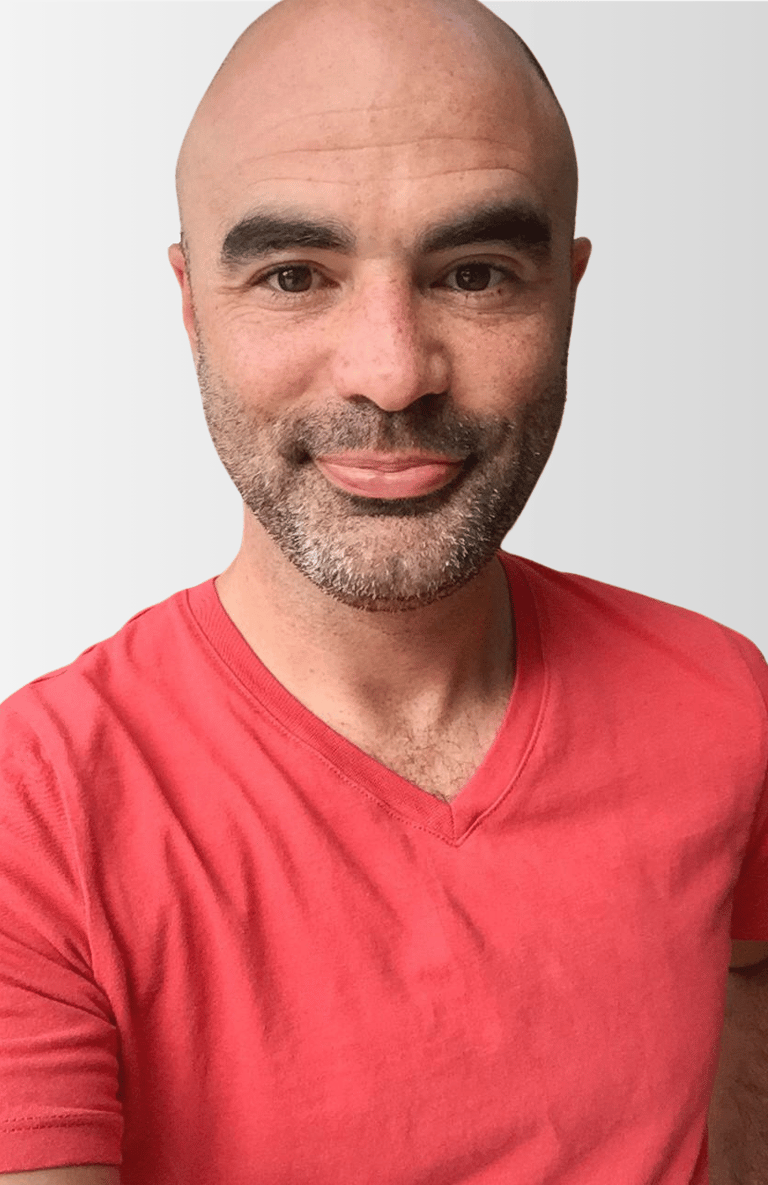 Brian Tyson, a man with a bald head and a red t-shirt