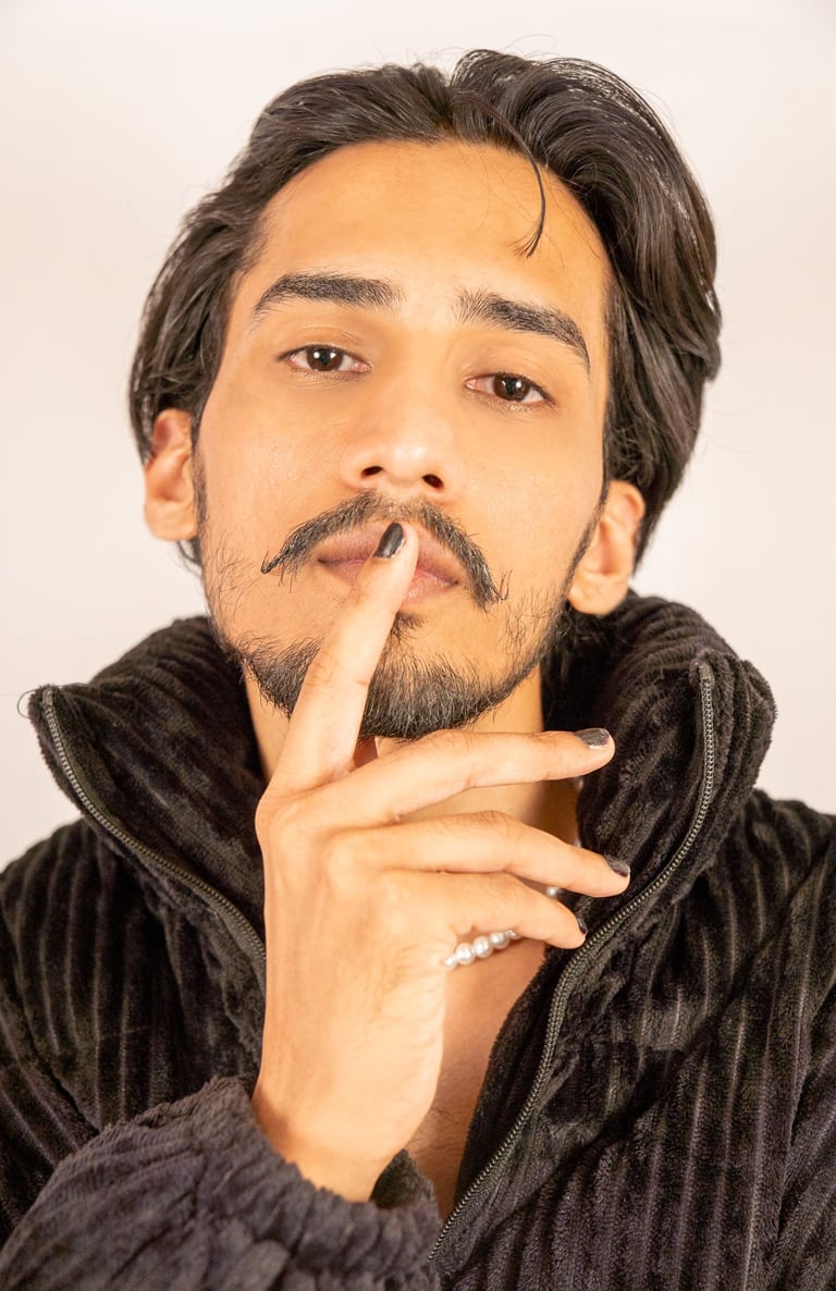 a man with a mustache and a mustache on his finger