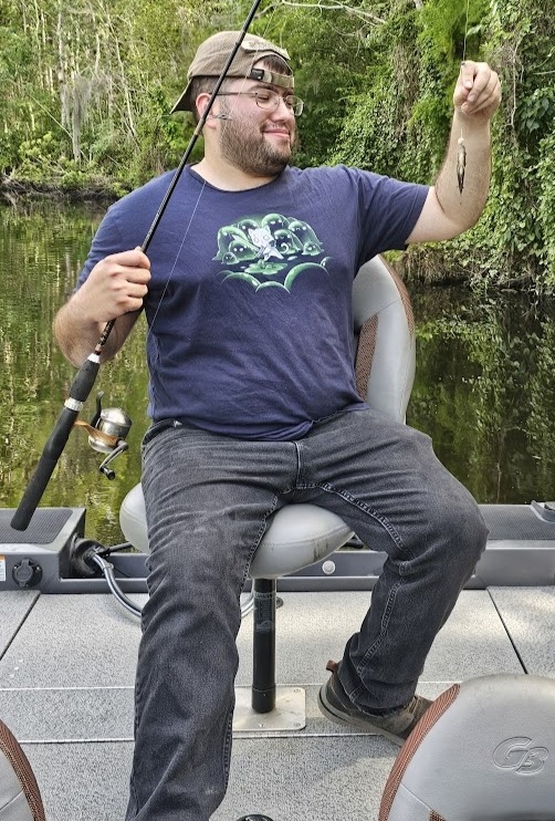 Michael holding a small bream