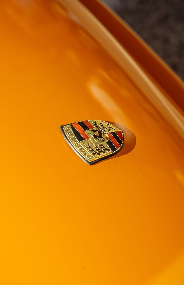 Porsche logo close-up photo captured by BrandNests for automotive marketing and branding.