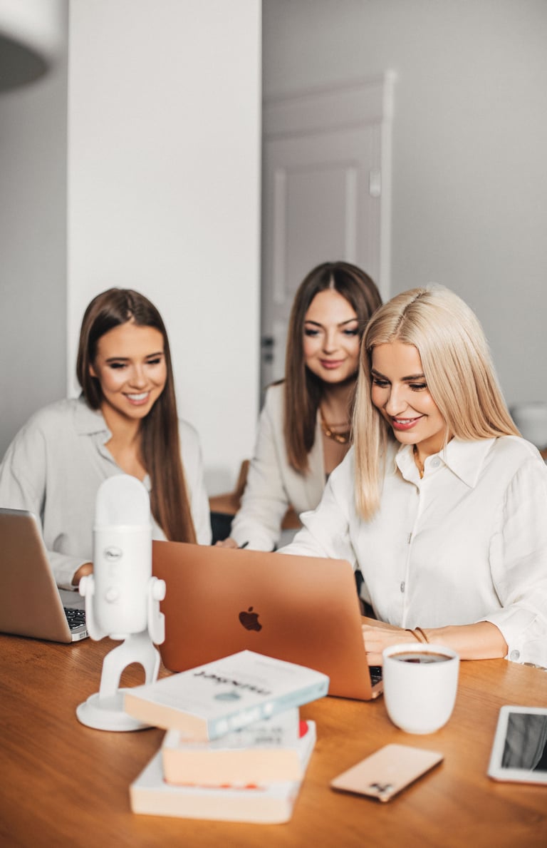 women using a laptop computer to contact medaesthetics laser and wellness