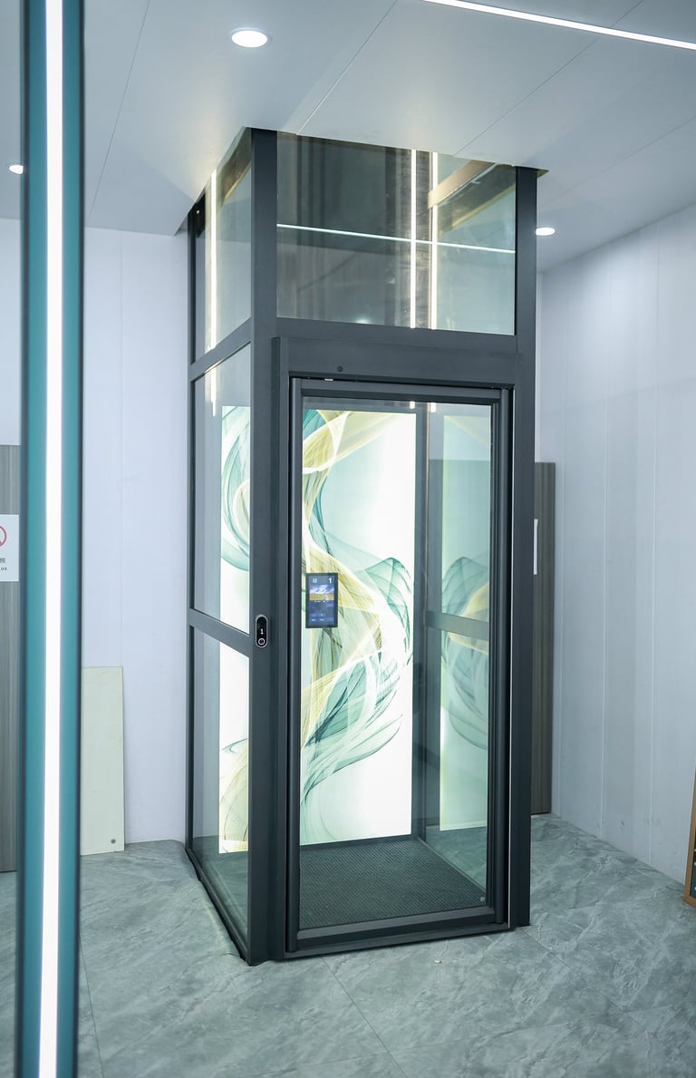 Modern luxury glass residential elevator with a custom artistic back panel installed in a home.