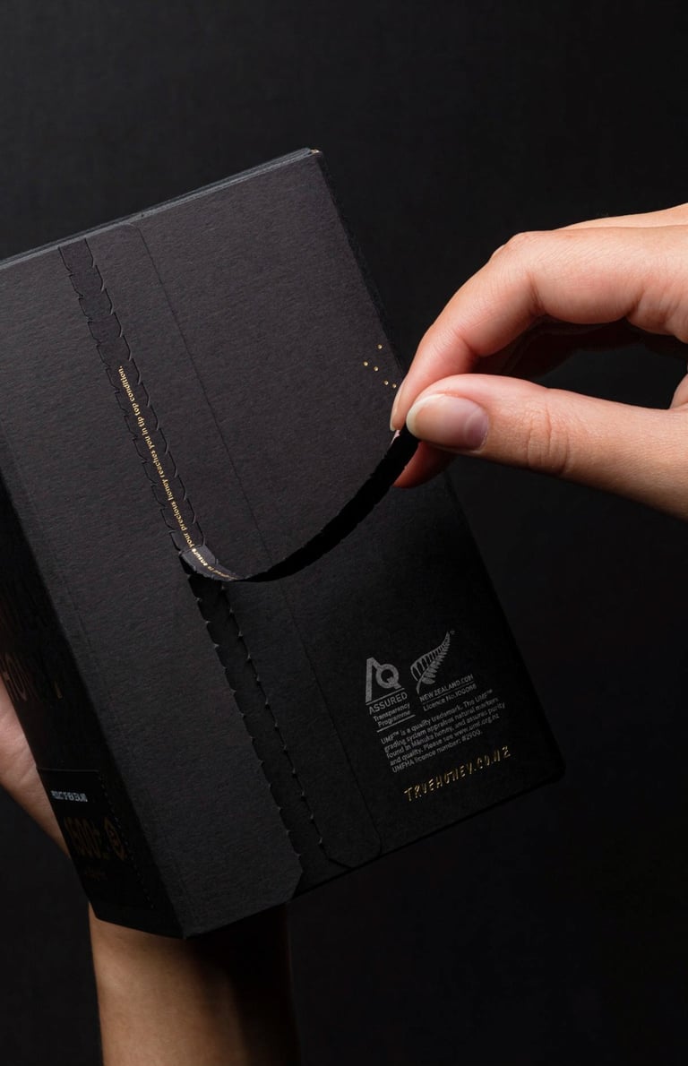 Product photography - a person holding a black box of honey