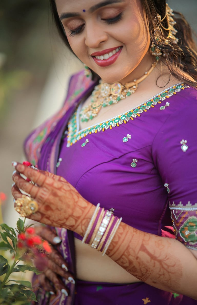 "Close-up of bridal mehendi hands with emerald kundan necklace and bangles — Indian bridal jewelry s