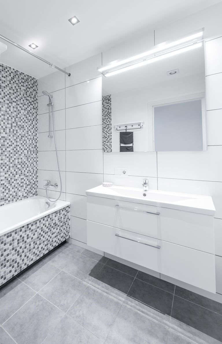 Ceramic tile flooring in a modern bathroom designed for durability and water resistance.