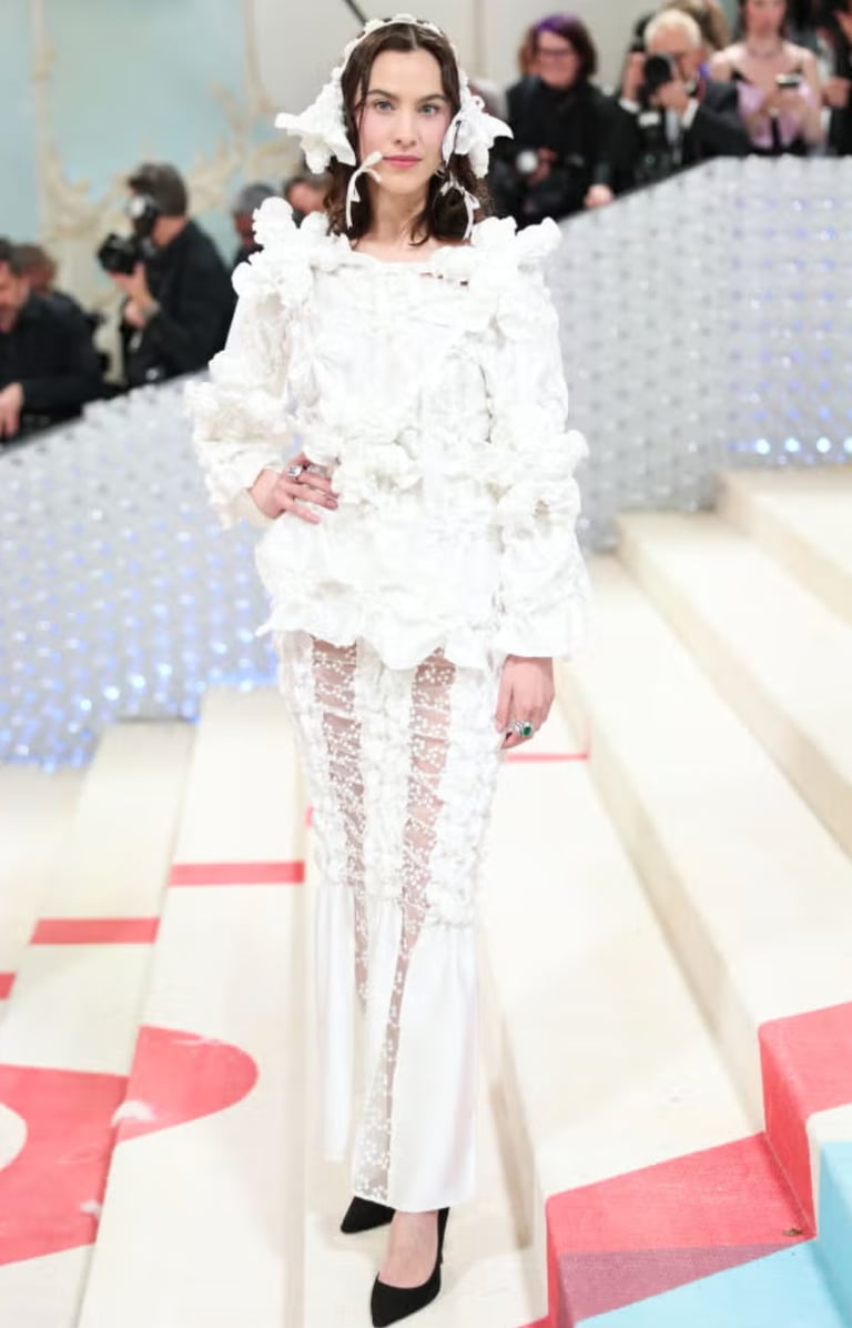 Alexa Chung in handcrafted white floral couture at Met Gala.