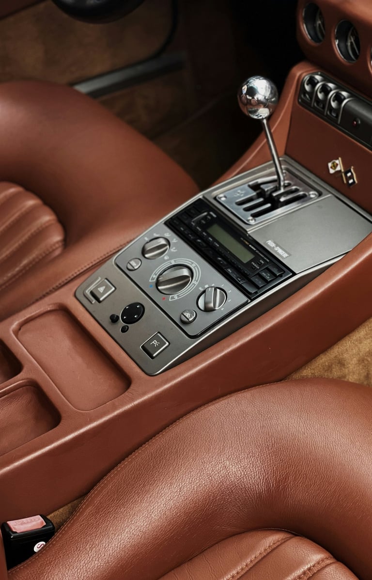 a car dashboard with a clock and a clock on the dashboard