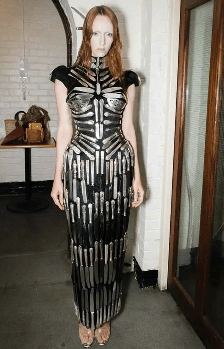 Avant-garde couture gown crafted from antique silver cutlery.