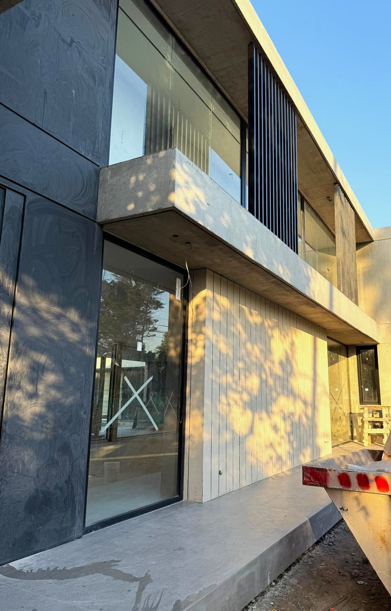a skateboarder is riding down a ramp in the city