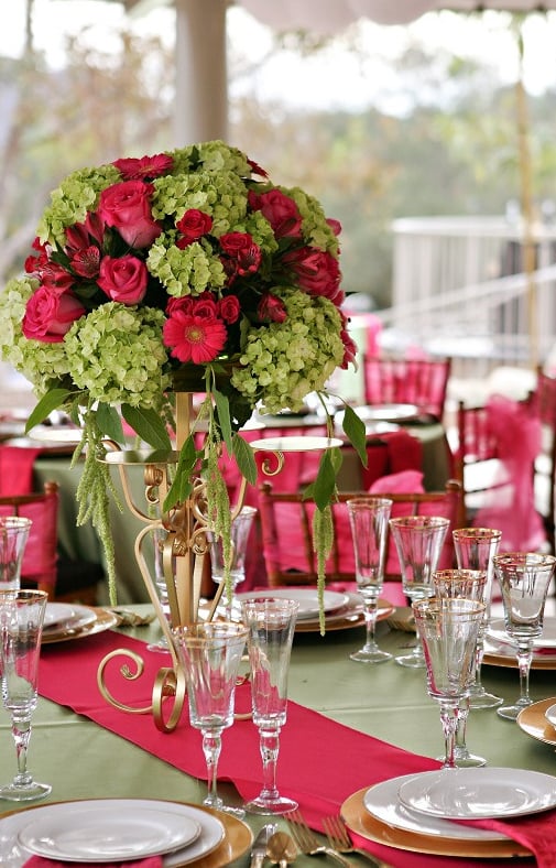 wedding table setting with fuschsia and sage linens and flowers