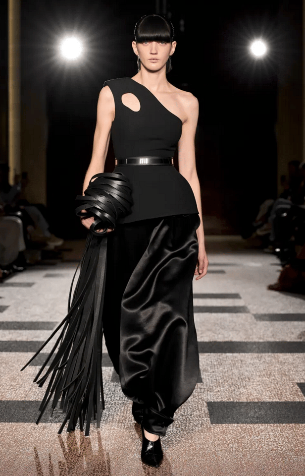 Roksanda model in black asymmetric top and satin trousers on the runway at London Fashion Week 2026.