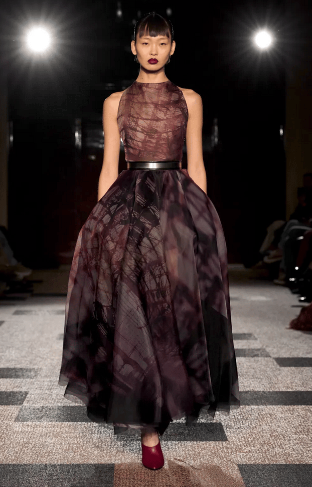 Roksanda model in burgundy printed tulle gown on the runway at London Fashion Week 2026.