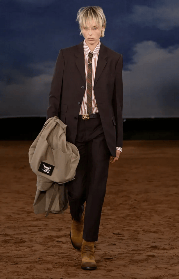 Burberry model in tailored suit with striped shirt and tie at London Fashion Week 2026.