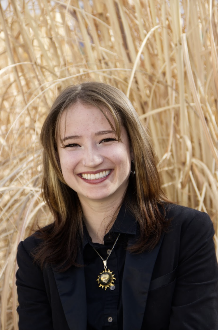 Headshot of Haven Bohn in a black suit.