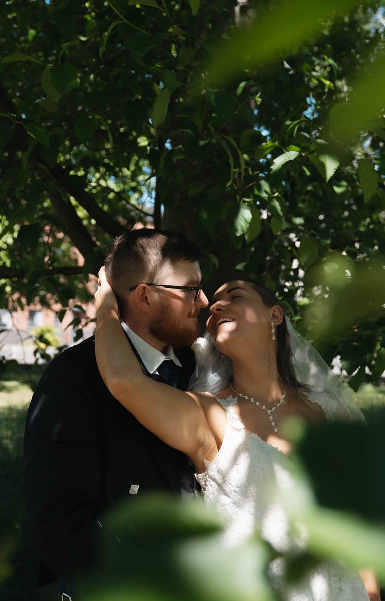 a bride and groom are posing for a photo