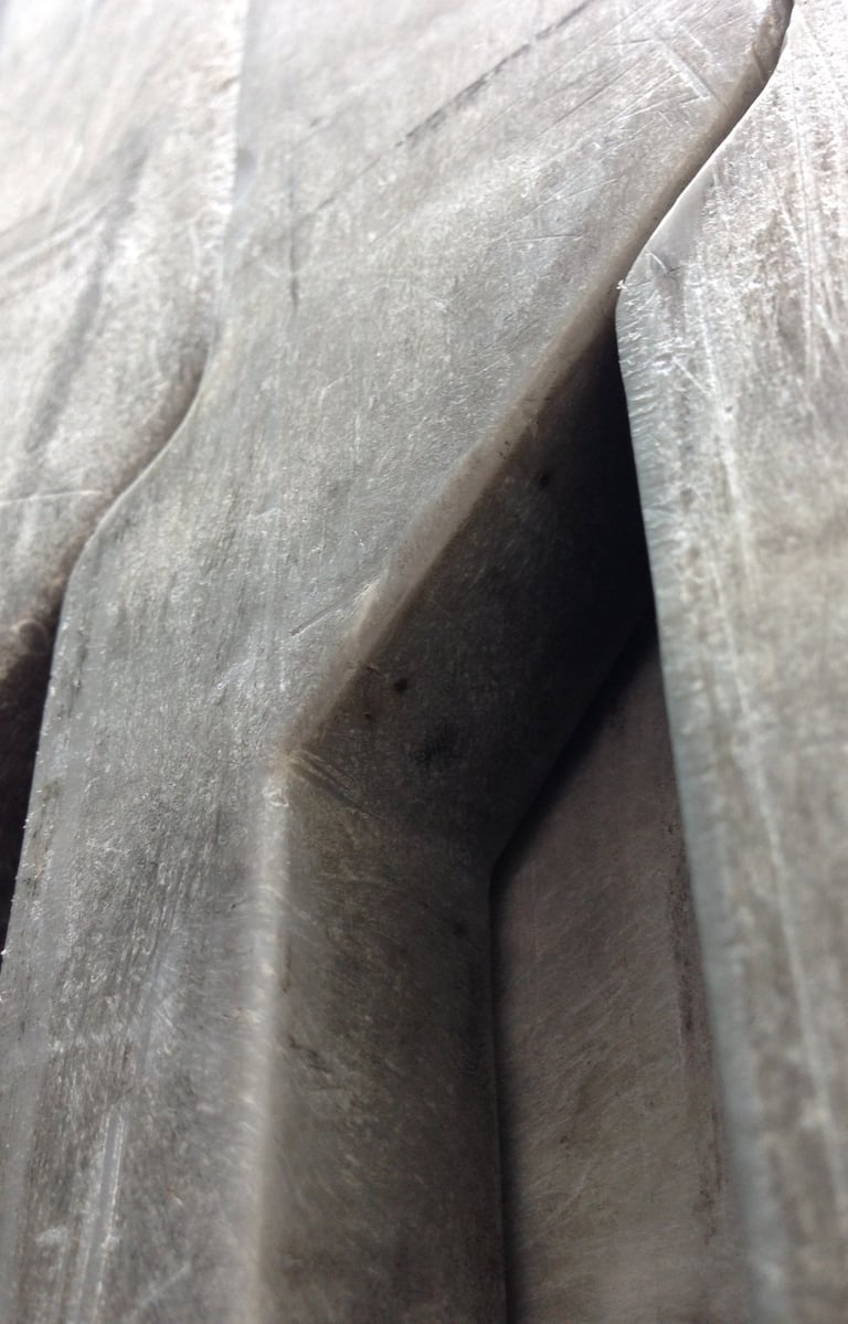 Rectangular massive metal shapes with angular spacing resembling pillars or elephants legs.