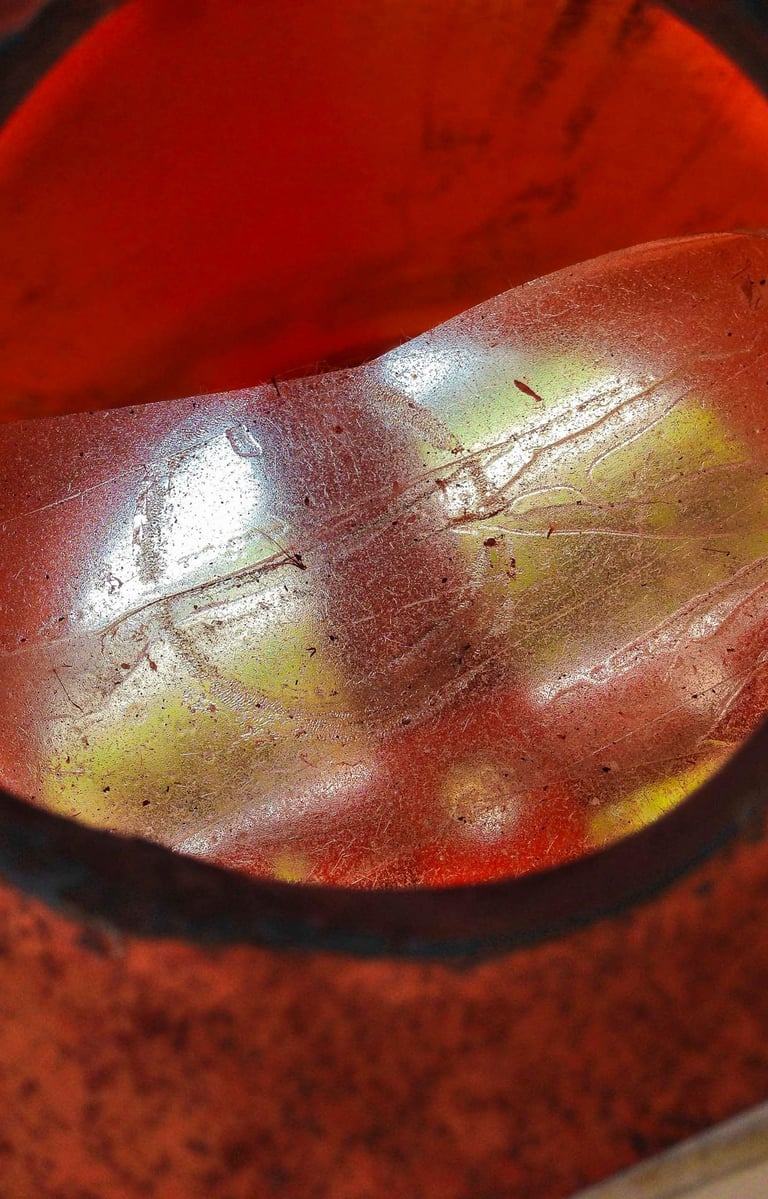 Bright red circular shiny object reflecting light.