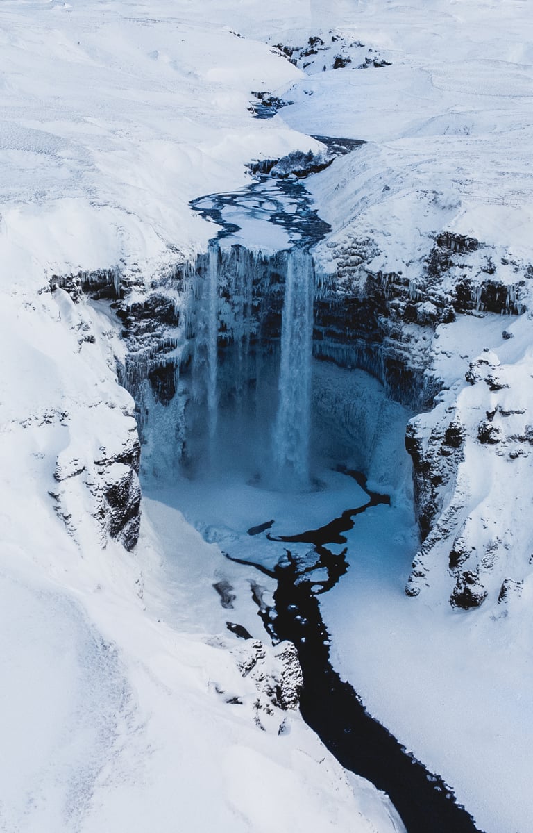 a waterfall in the snow 