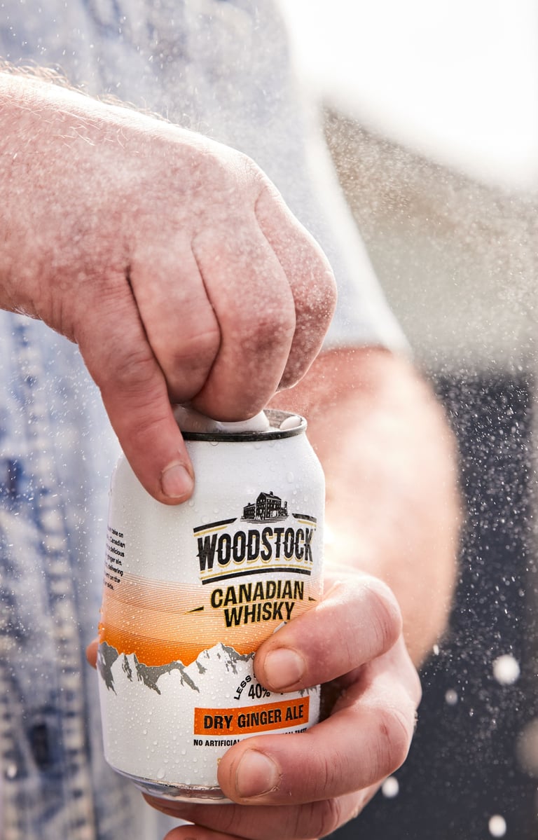Product photography - a man opening a can of woodstock