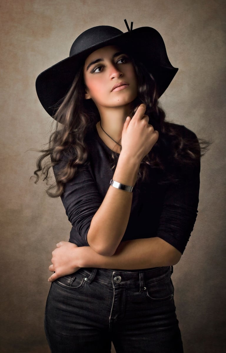 a Fine art children portrait photography of a girl wearing a black hat in a Western Sydney studio