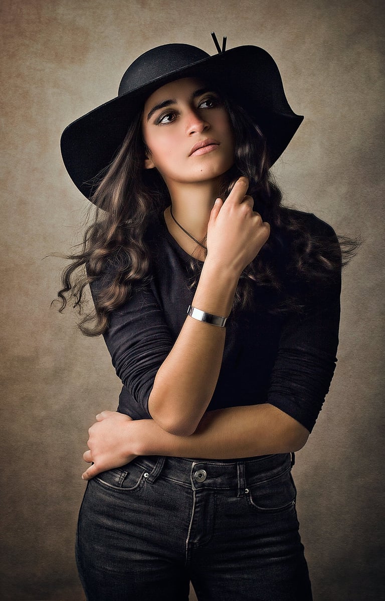 a Fine art children portrait photography of a girl wearing a black hat in a Sydney studio