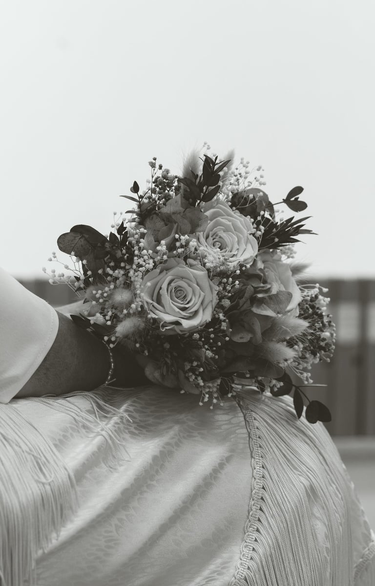 a bridesmael holding a bouquet of flowers