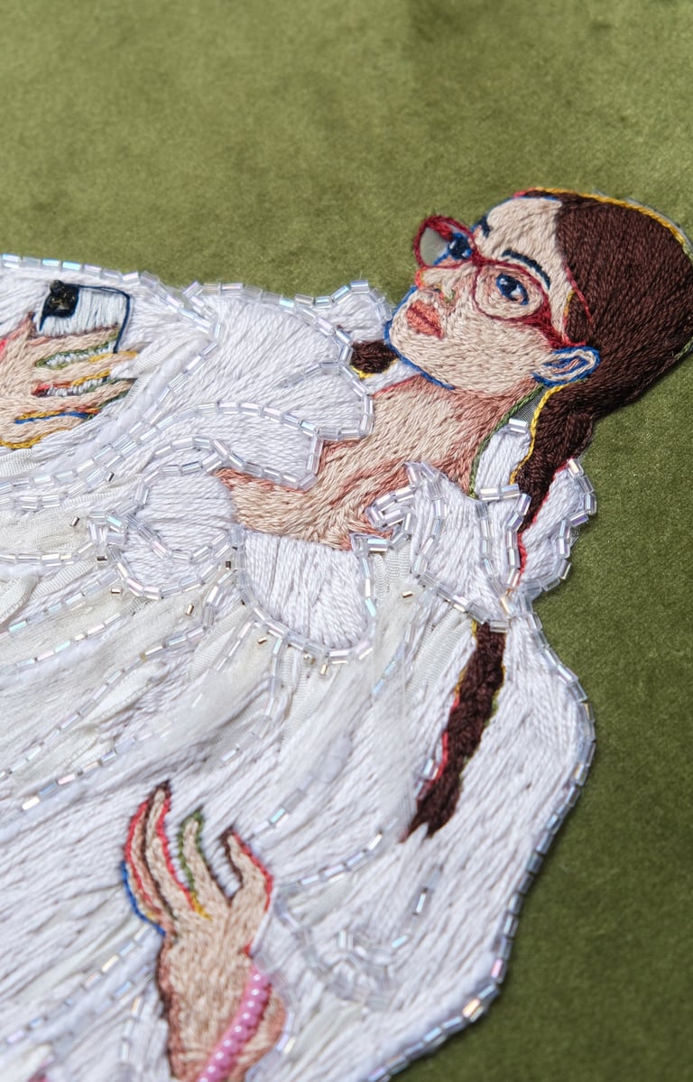 a woman in a white fur coat and boots embroidery and beaded pink bag