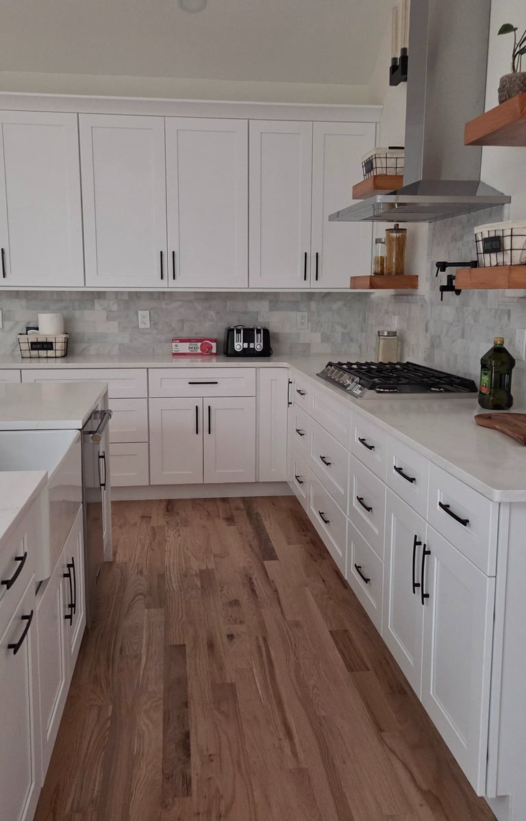 Modern kitchen layout with open flow, smart storage, sleek surfaces, and integrated appliances.