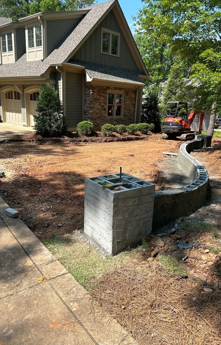 During motor court project. Block masonry. Grading.