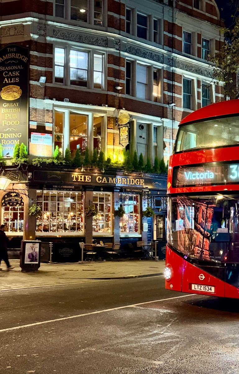 London double-decker bus in front of The Cambridge Pub in Theater District