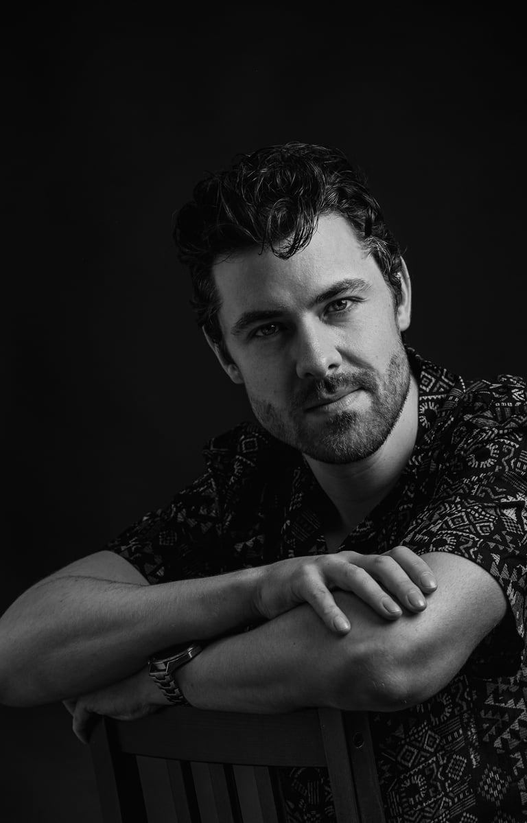 a man with a watch on his wrist fashion shoot creative