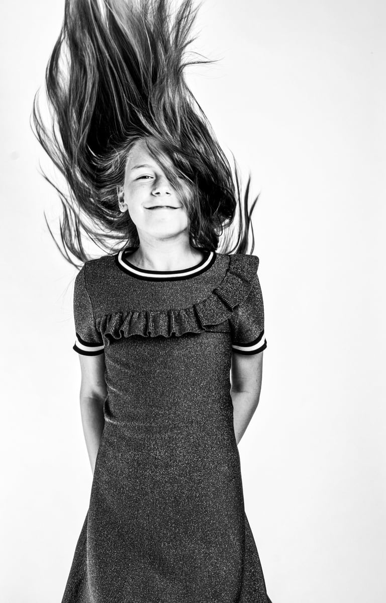 portret of a young girl with her hair in a dress