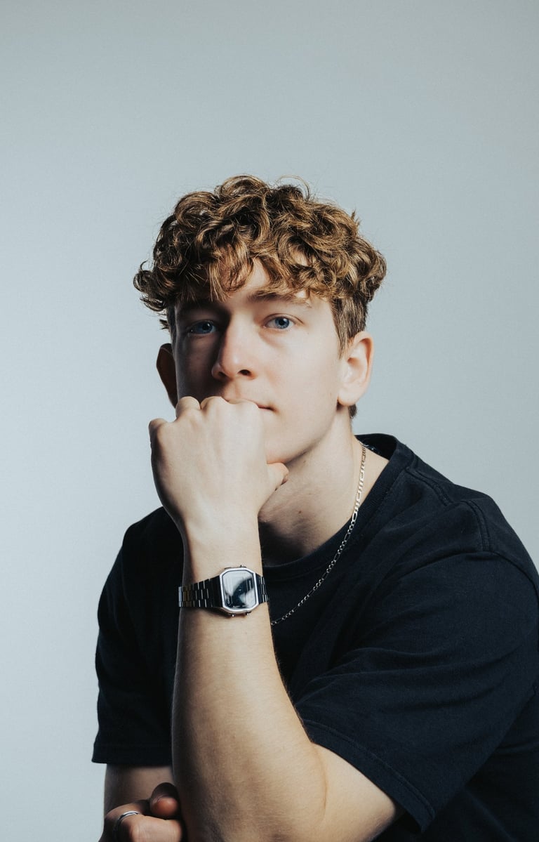 portrait of a man with a watch on his wrist